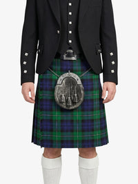 Person wearing a black jacket and green plaid kilt with a sporran on a white background