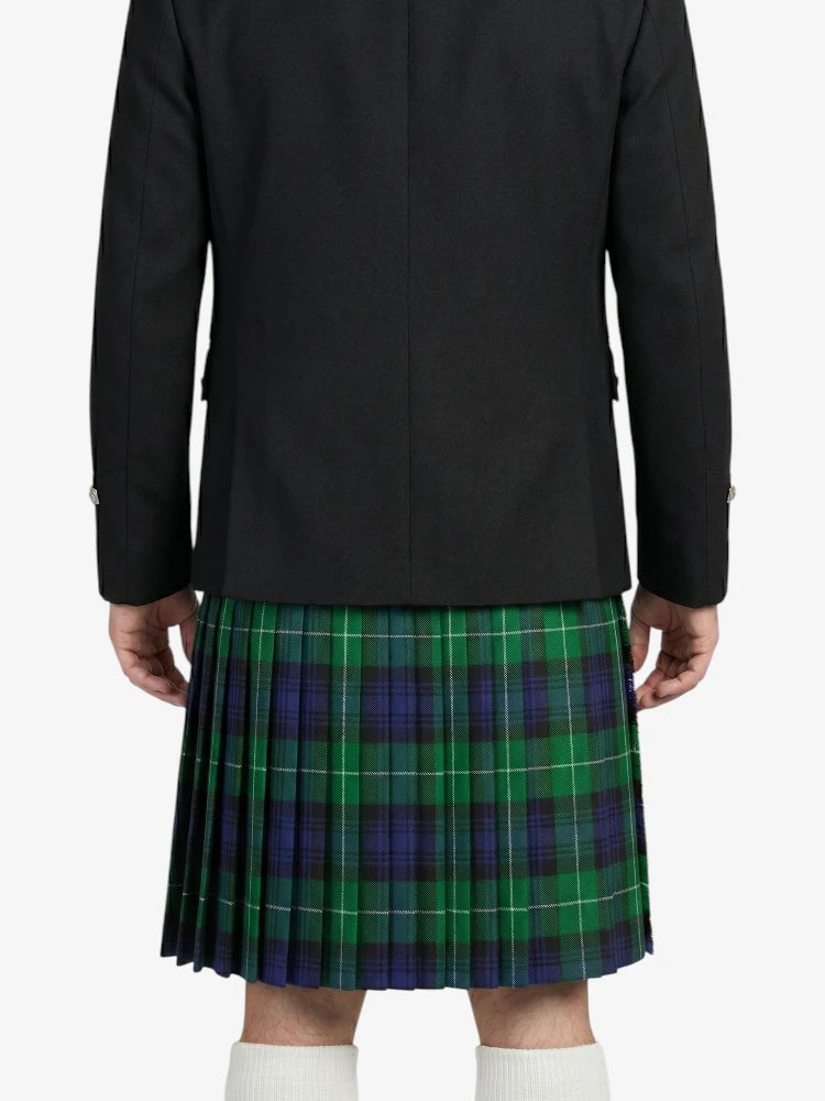 Person wearing a black coat and green plaid kilt on a white background