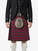 Person wearing a traditional Scottish kilt with a tartan pattern on a white background