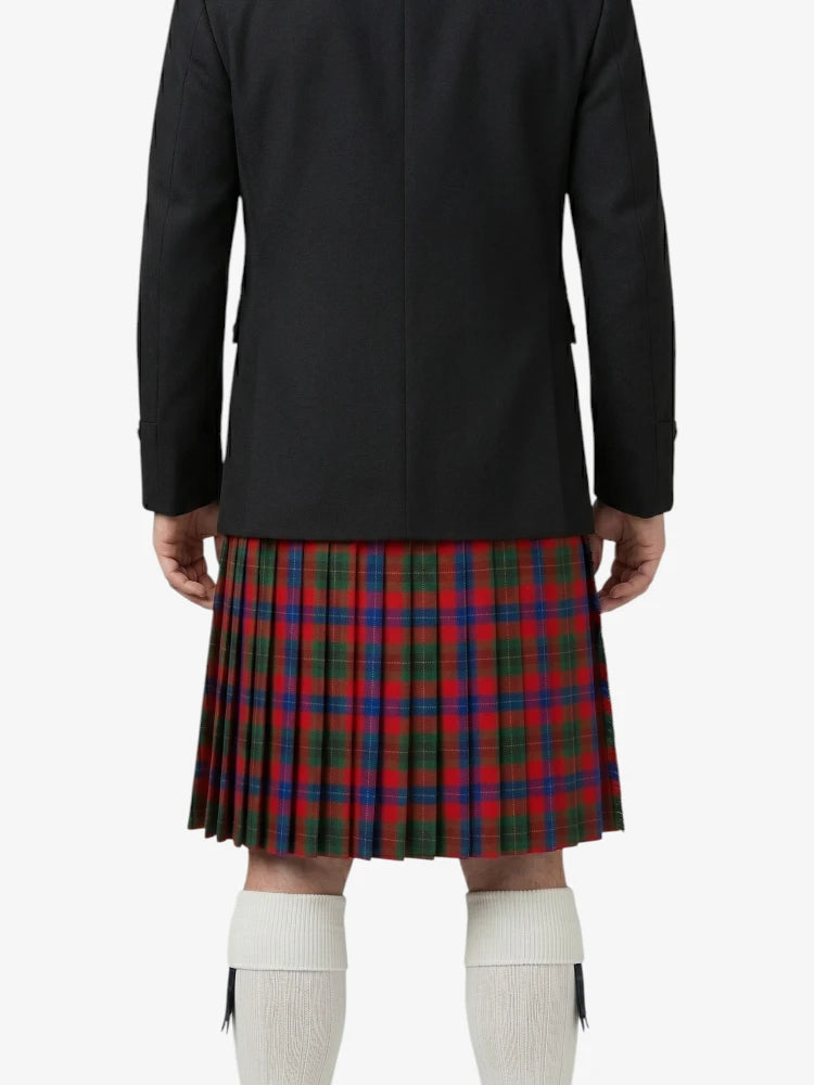 Person wearing a black jacket and red plaid kilt on a white background