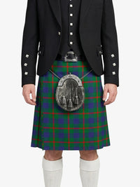 Person wearing a black jacket and green plaid kilt with a sporran on a white background