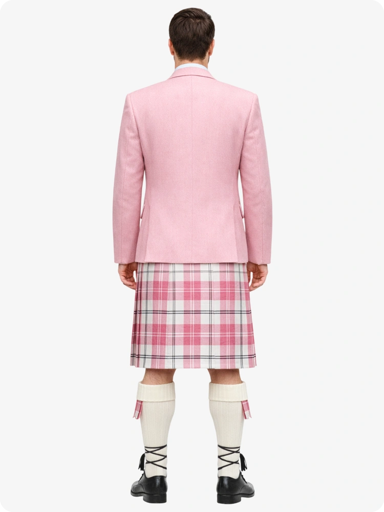 Person wearing a pink blazer and plaid kilt on a white background