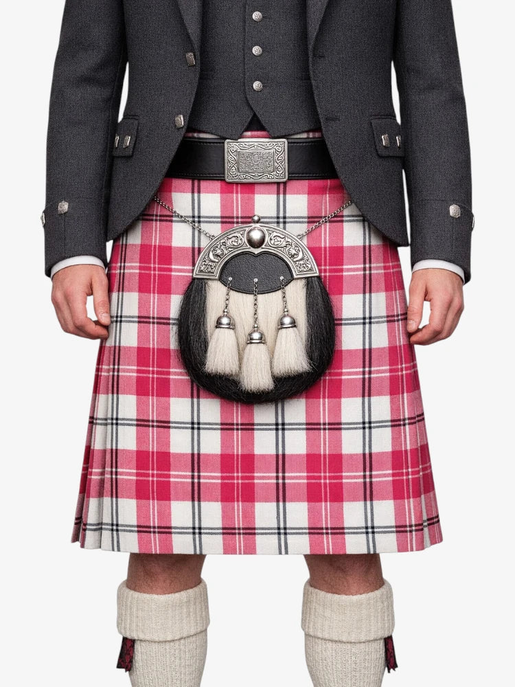 Person wearing a traditional Scottish kilt with a tartan pattern on a white background