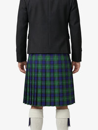 Person wearing a black jacket and green plaid kilt on a white background