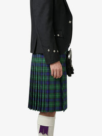Person wearing a dark jacket and green plaid kilt on a white background