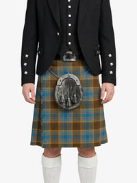 Person wearing a traditional Scottish kilt with a tartan pattern on a white background