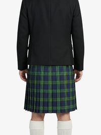 Person wearing a black jacket and green plaid kilt on a white background