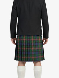 Person wearing a black jacket and green plaid kilt on a white background
