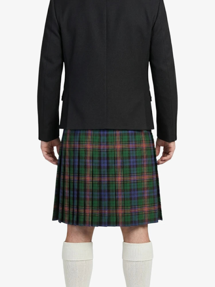 Person wearing a black jacket and green plaid kilt on a white background
