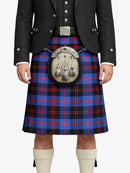 Person wearing a traditional Scottish kilt with a plaid pattern on a white background