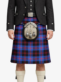 Person wearing a traditional Scottish kilt with a plaid pattern on a white background