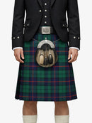 Person wearing a traditional Scottish kilt with a tartan pattern on a white background
