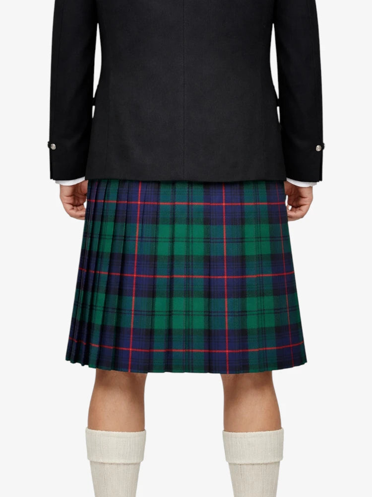 Person wearing a black jacket and green plaid kilt on a white background
