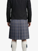 Person wearing a black jacket and plaid kilt on a white background