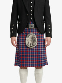 Person wearing a traditional Scottish kilt with a tartan pattern on a white background