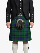 Person wearing a traditional Scottish kilt with a sporran on a white background