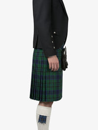 Person wearing a black jacket and green plaid kilt on a white background