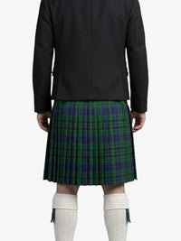 Person wearing a black jacket and green plaid kilt on a white background