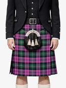 Person wearing a Scottish kilt with a tartan pattern on a white background