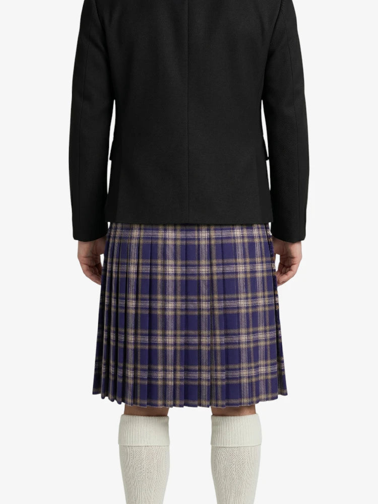 Person wearing a black jacket and plaid kilt on a white background