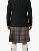 Person wearing a black jacket and plaid kilt on a white background