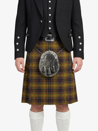 Person wearing a traditional Scottish kilt with a jacket on a white background