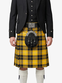 Person wearing a yellow and black plaid kilt with a black jacket on a white background