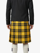 Person wearing a black coat and yellow plaid kilt on a white background