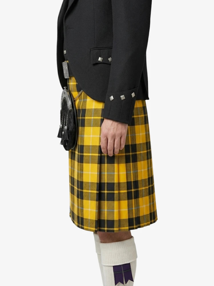 Person wearing a black jacket and yellow plaid kilt on a white background