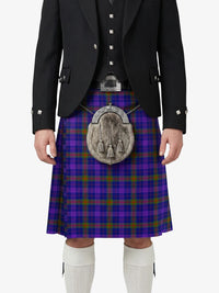 Person wearing a traditional Scottish kilt with a tartan pattern on a white background