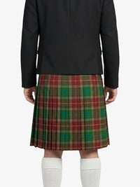 Person wearing a black jacket and plaid kilt on a white background