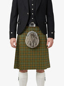 Person wearing a traditional Scottish kilt with a jacket on a white background
