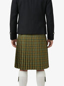 Person wearing a black jacket and green plaid kilt on a white background