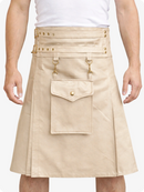 Beige skirt with gold accents worn by a person on a white background