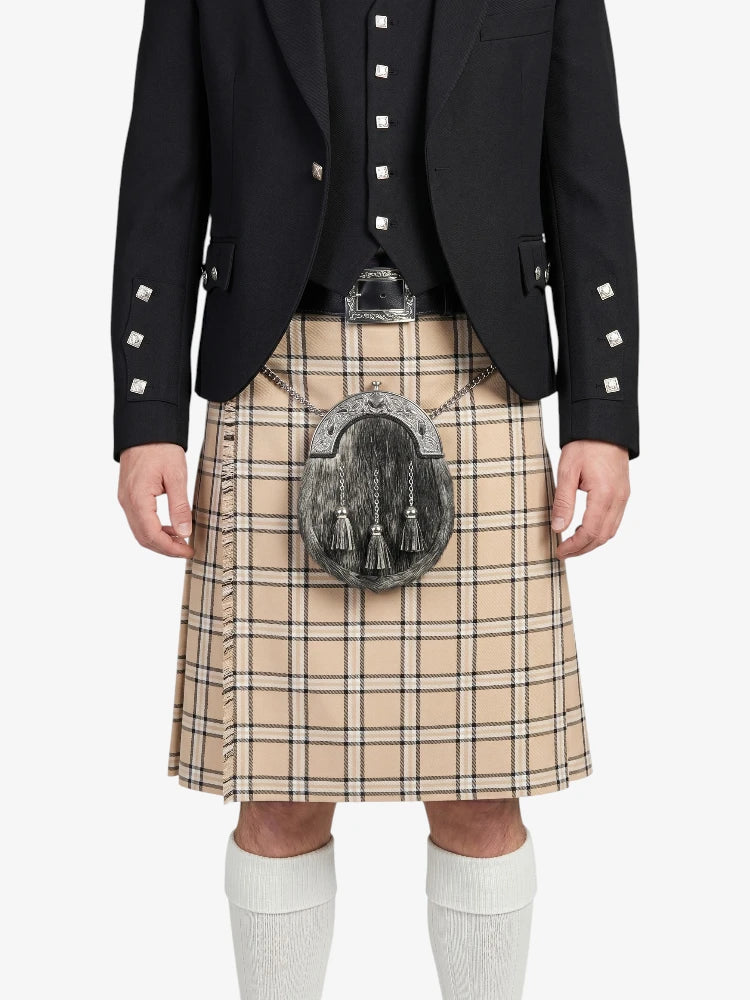 Person wearing a black jacket, beige plaid kilt, and white socks on a white background