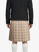 Person wearing a black coat and beige plaid kilt on a white background