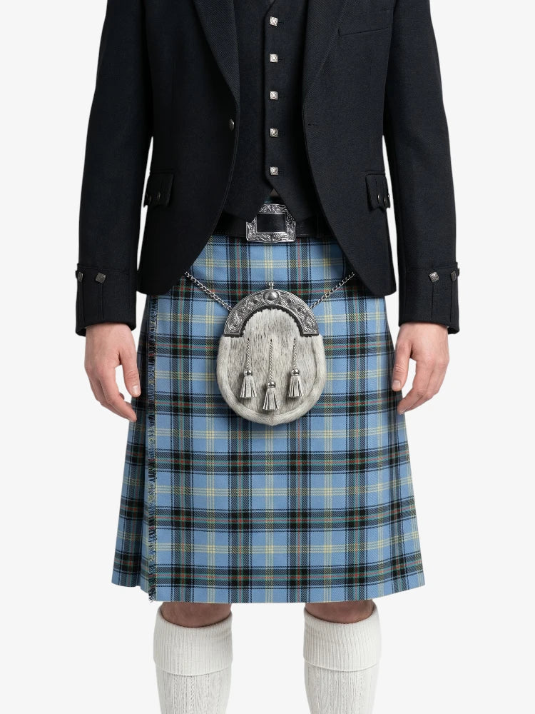Person wearing a blue plaid kilt with a black jacket on a white background