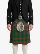 Person wearing a traditional Scottish kilt with a tartan pattern on a white background