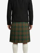 Person wearing a black jacket and green plaid skirt on a white background