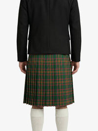 Person wearing a black jacket and green plaid skirt on a white background