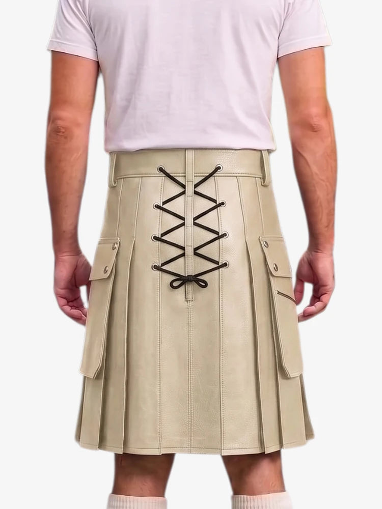 A beige pleated kilt with black lace-up detailing on the back, shown on a model wearing a light pink t-shirt against a white background.