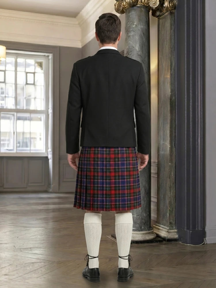 Man wearing a black jacket and red plaid kilt in an indoor setting.