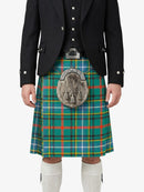Person wearing a traditional Scottish kilt with a plaid pattern on a white background