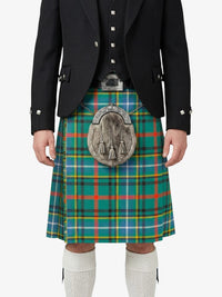 Person wearing a traditional Scottish kilt with a plaid pattern on a white background