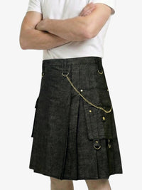 Person wearing a black kilt with gold accents on a white background