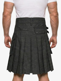 Person wearing a gray pleated kilt on a white background
