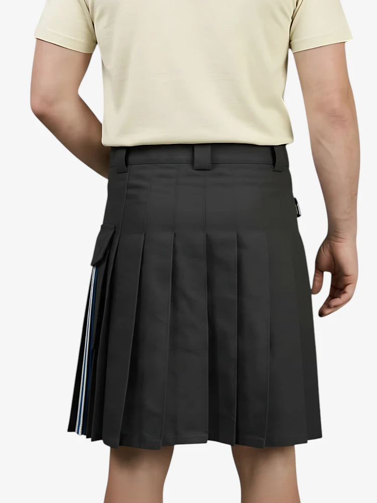 Person wearing a black pleated skirt with a plain background