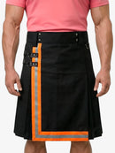 Black kilt with orange trim worn by a person in a pink shirt on a white background