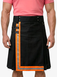Black kilt with orange trim worn by a person in a pink shirt on a white background