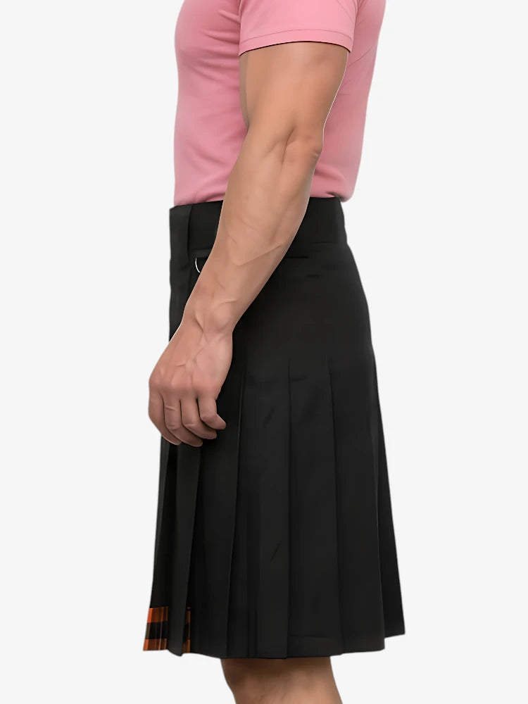 Person wearing a black pleated skirt with a pink top on a white background